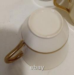 18k. Gold Demitasse Cups And Saucers