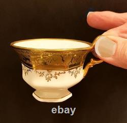 1920's Demitasse set. 8 cups/saucers. Encrusted gold. Porzellan Karlsbader. MINT