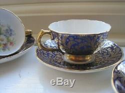 5 x PARAGON DEMITASSE FOOTED CABINET CUPS AND SAUCERS GILDED FLORAL COBALT BLUE
