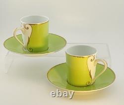 A Pair of Christian Lacroix France Follement Green Demitasse Cup and Saucer Set