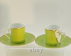A Pair of Christian Lacroix France Follement Green Demitasse Cup and Saucer Set