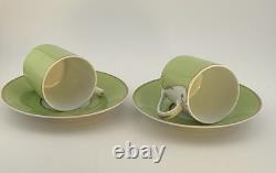 A Pair of Christian Lacroix France Follement Green Demitasse Cup and Saucer Set