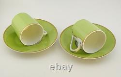 A Pair of Christian Lacroix France Follement Green Demitasse Cup and Saucer Set