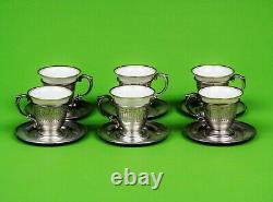 A set of six sterling silver demitasse or espresso coffee cups and saucers