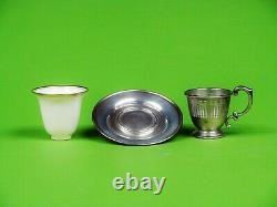A set of six sterling silver demitasse or espresso coffee cups and saucers